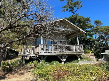a view of balcony with wooden fence and plants