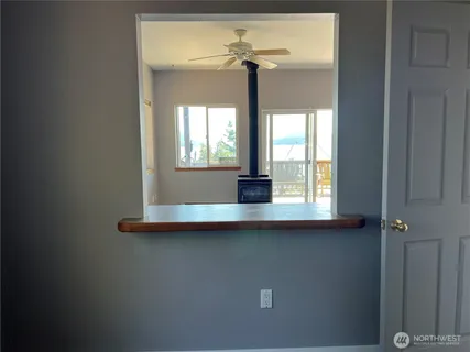 a view of pool table and chandelier fan