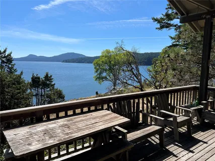a view of a balcony with wooden floor and outdoor space