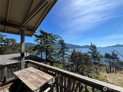 a view of a balcony with wooden floor