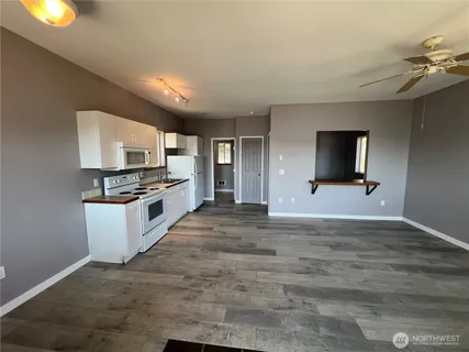 a view of a kitchen with microwave and stove