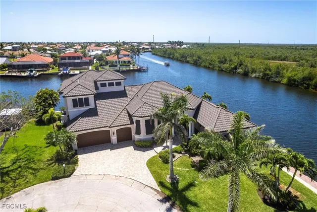 an aerial view of a house with a lake view