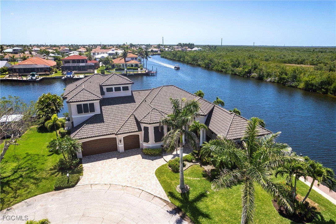 an aerial view of a house with a lake view