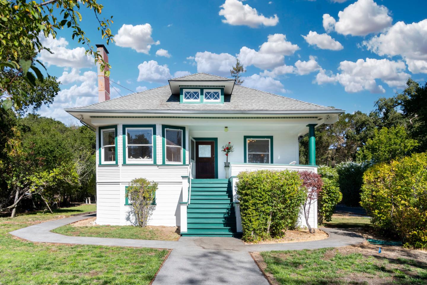 3190 Woodside Road Woodside, CA 94062 - Photo 1 of 34 a front view of a house with garden