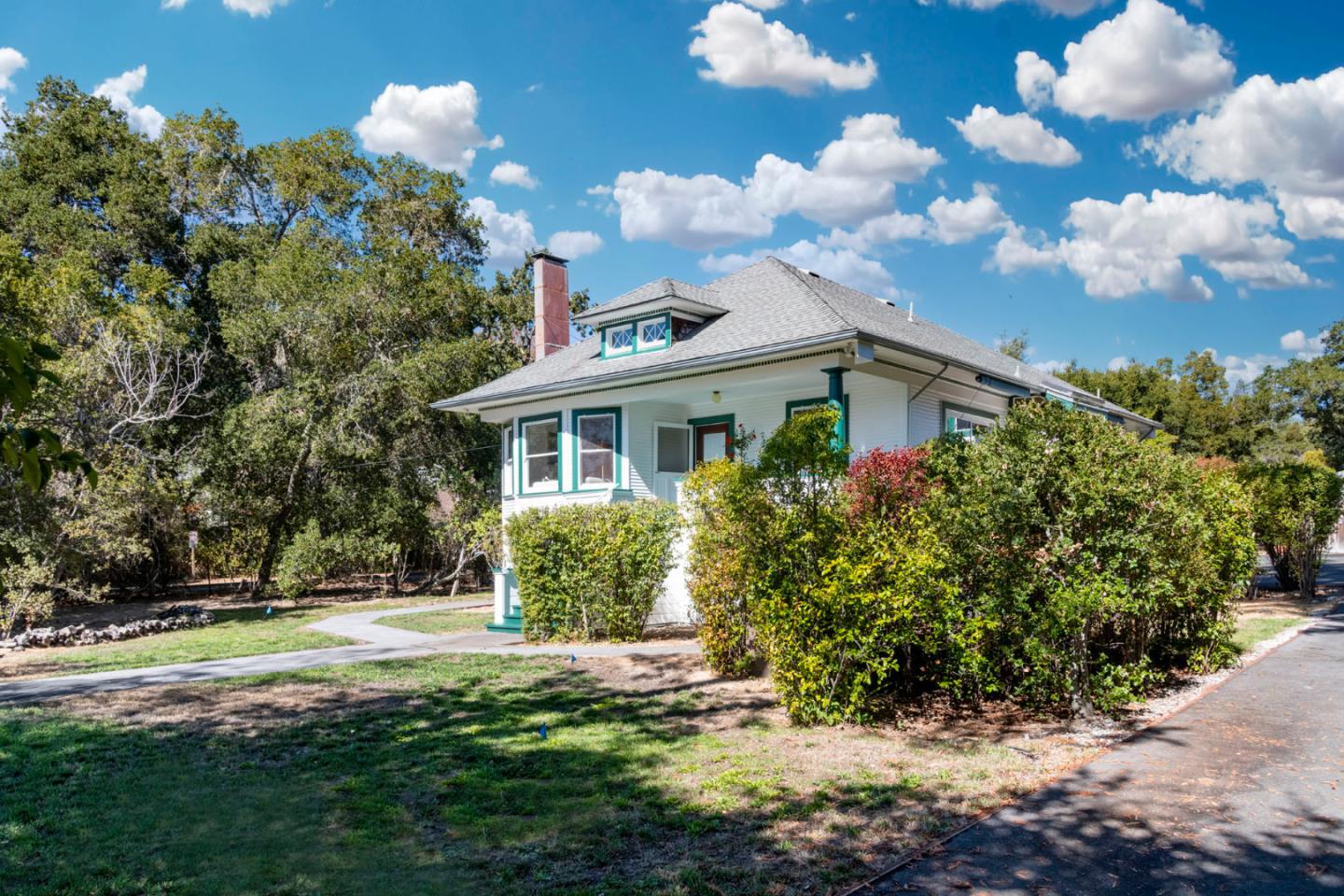3190 Woodside Road Woodside, CA 94062 - Photo 2 of 34 a front view of a house with garden