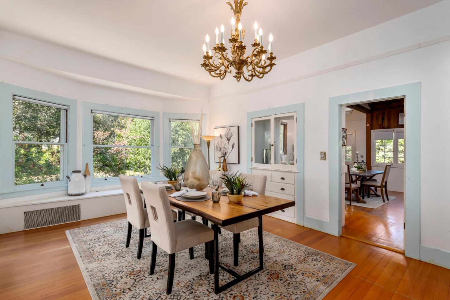 3190 Woodside Road Woodside, CA 94062 - Photo 12 of 34 a view of a dining room with furniture window and wooden floor