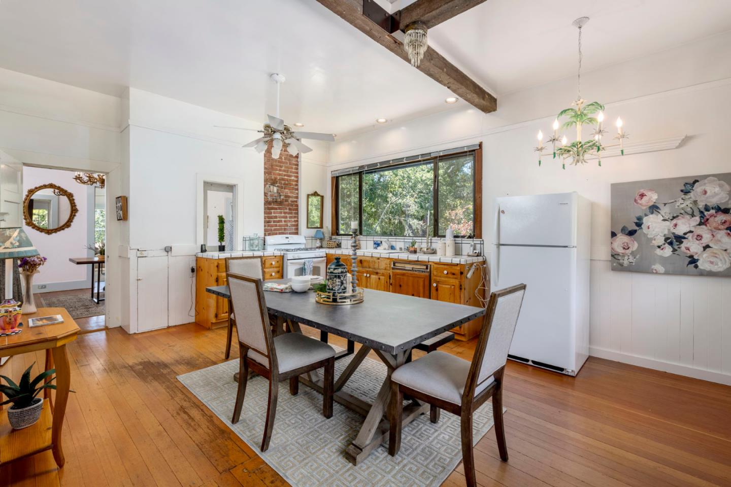 3190 Woodside Road Woodside, CA 94062 - Photo 15 of 34 a view of a dining room with furniture window and wooden floor