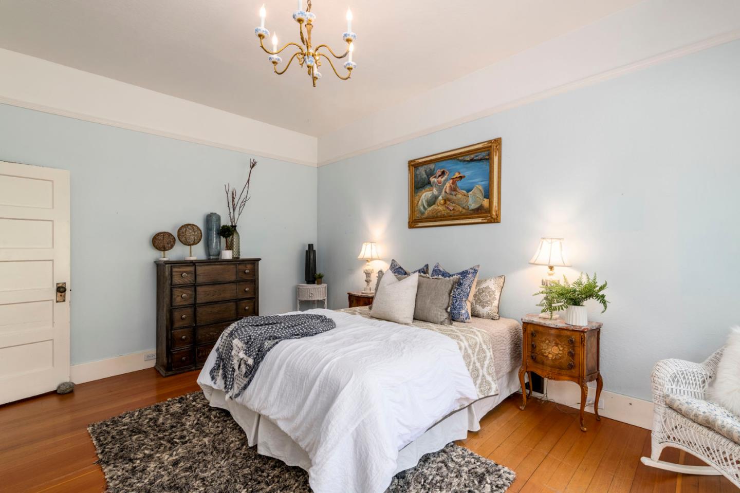 3190 Woodside Road Woodside, CA 94062 - Photo 20 of 34 a bedroom with a bed and wooden floor