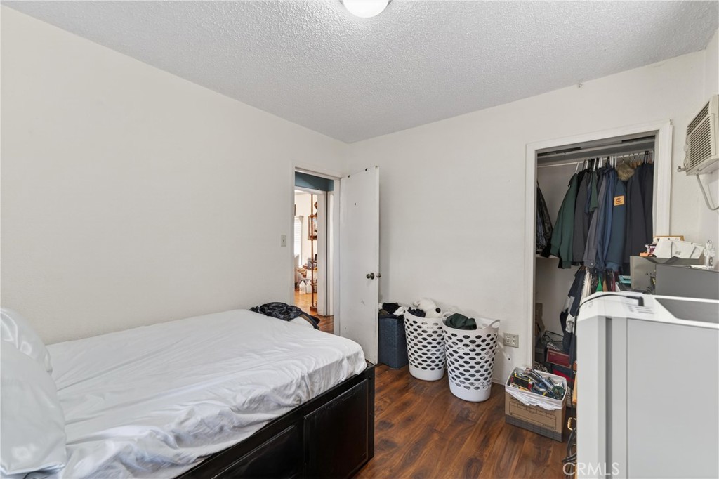 2437 Bloomdale Street Duarte, CA 91010 - Photo 12 of 23 a bedroom with a bed and wooden floor