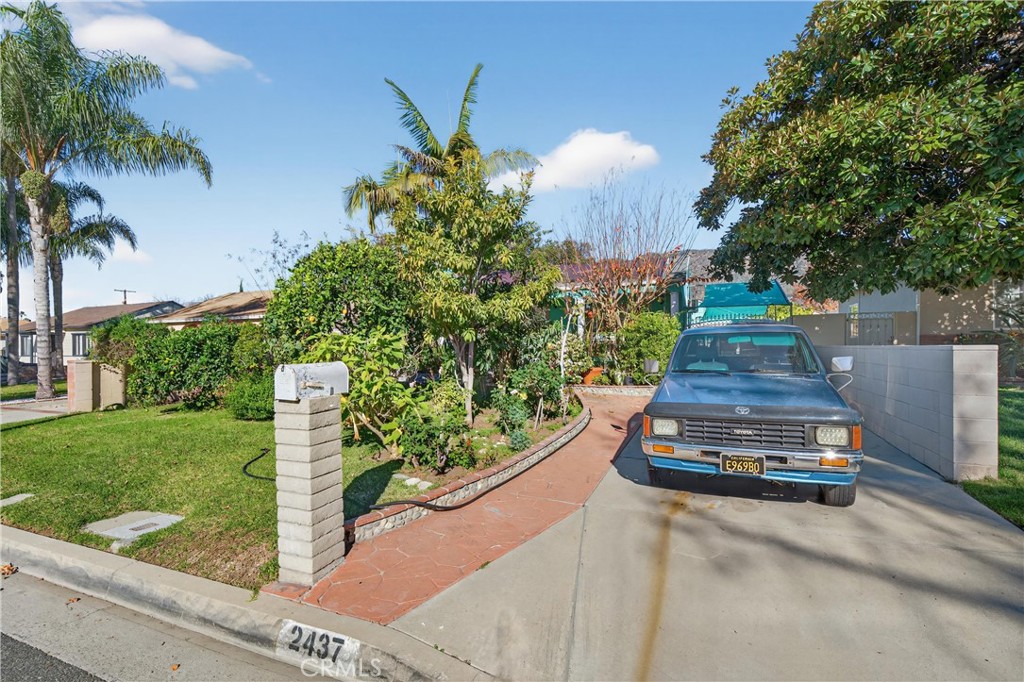 2437 Bloomdale Street Duarte, CA 91010 - Photo 17 of 23 a sign board with flower garden in front of it