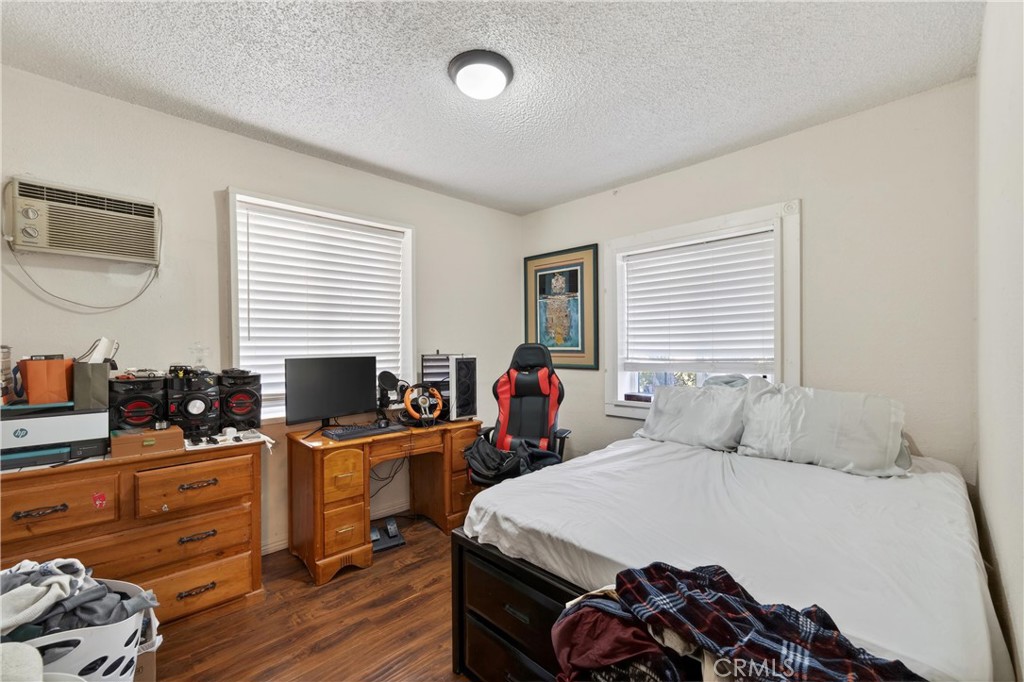 2437 Bloomdale Street Duarte, CA 91010 - Photo 19 of 23 a bedroom with a bed and wooden floor