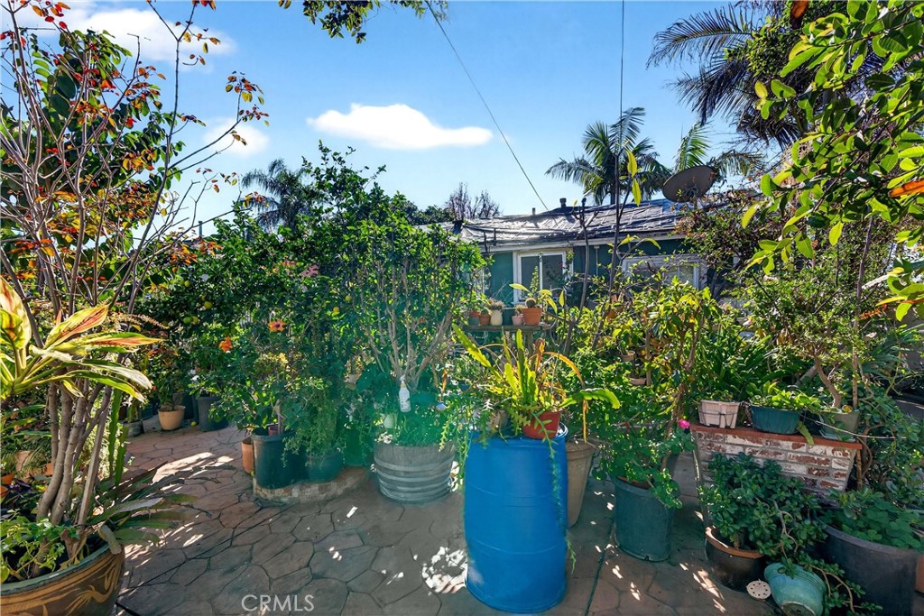 2437 Bloomdale Street Duarte, CA 91010 - Photo 22 of 23 a view of a house with a yard and potted plants
