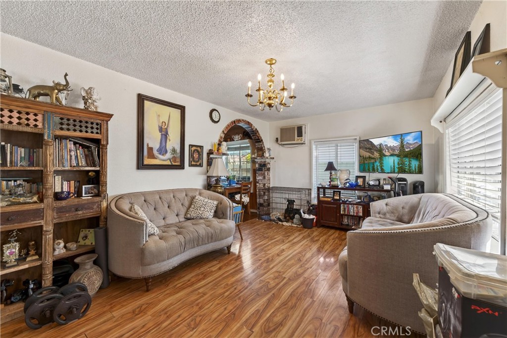2437 Bloomdale Street Duarte, CA 91010 - Photo 10 of 23 a living room with furniture and a wooden floor