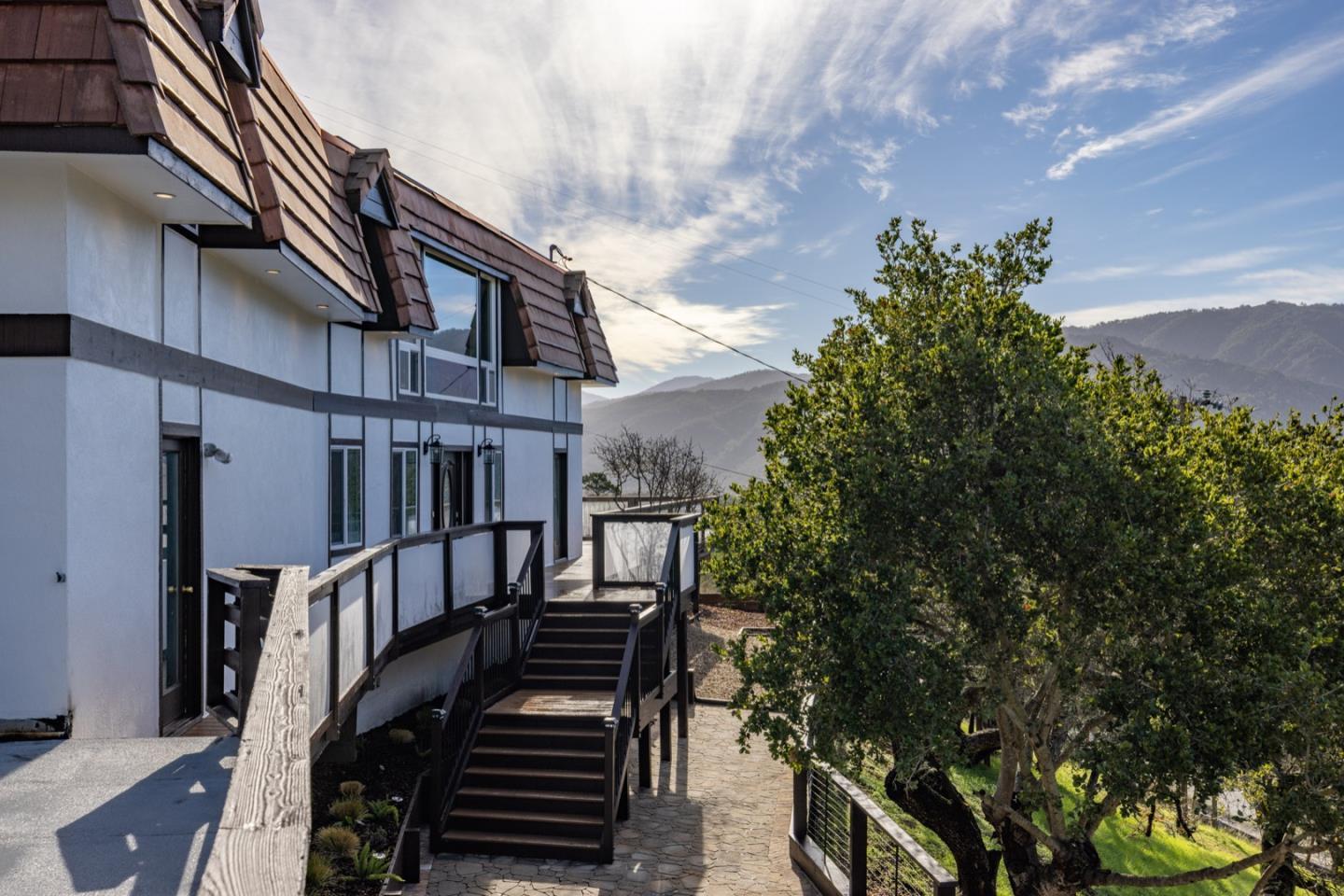 451 Laureles Grade Carmel Valley, CA 93924 - Photo 11 of 11 a view of a house with street and trees