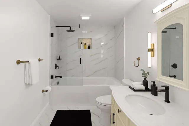 a bathroom with a sink toilet a shower and bathtub