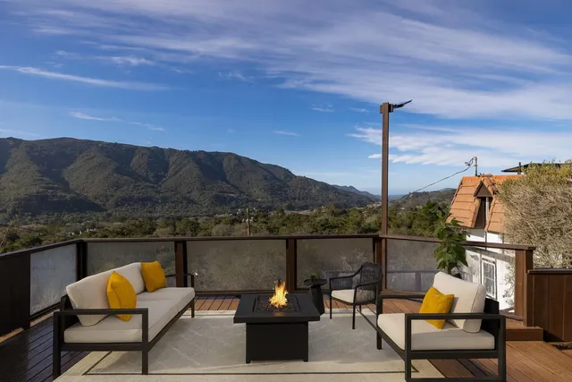 a terrace of a house with outdoor seating