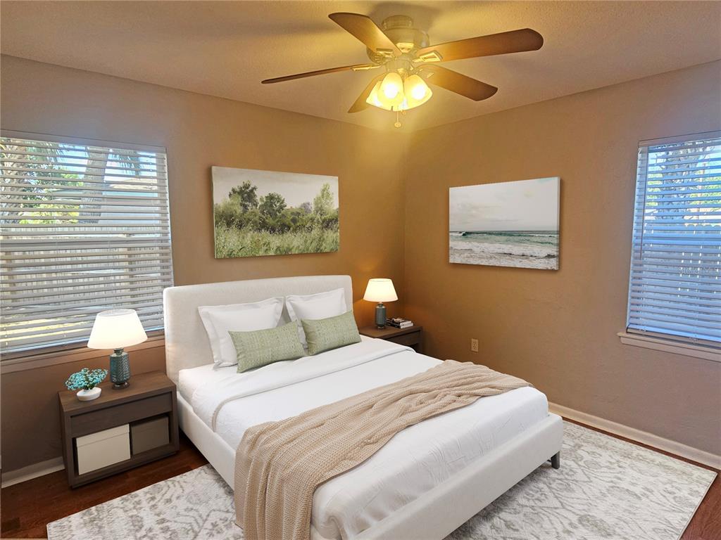 7000 Brentford Road Sarasota, FL 34241 - Photo 18 of 29 a bedroom with a bed and a chandelier
