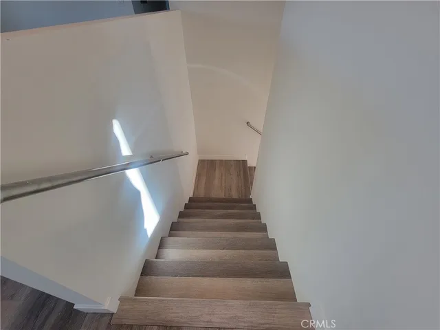 a view of kitchen and refrigerator