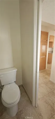 a bathroom with a toilet and a sink
