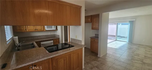 a kitchen with a stove and a refrigerator