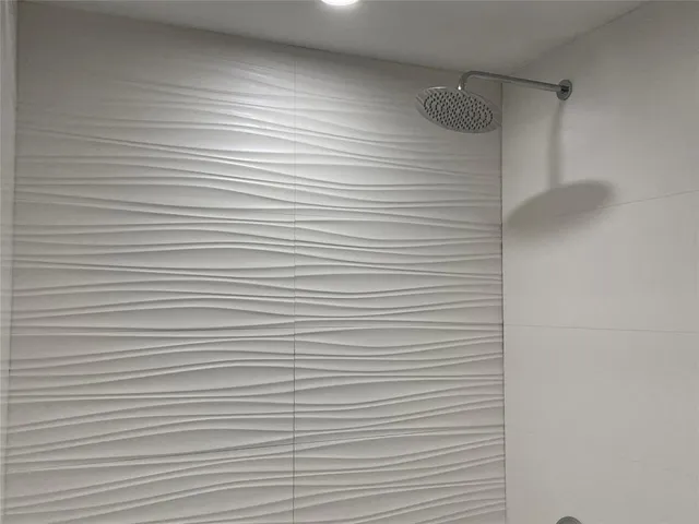 a room with gym equipment and windows