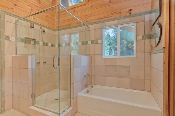 a bedroom with a bed and a tv