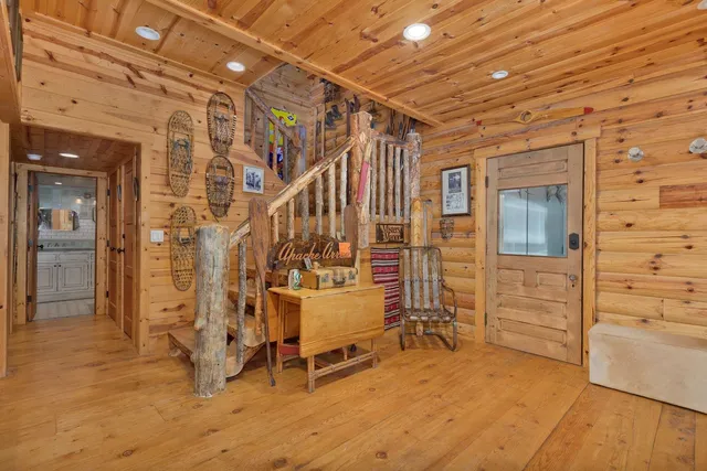 a bedroom with a bed and a painting on the wall