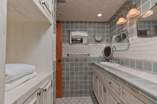 a bathroom with a tub and shower