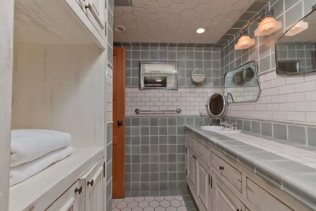 a bathroom with a tub and shower