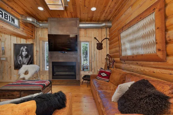 a roof deck with couch and chairs