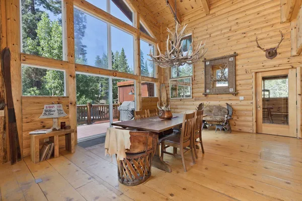 a view of a patio with a table and chairs