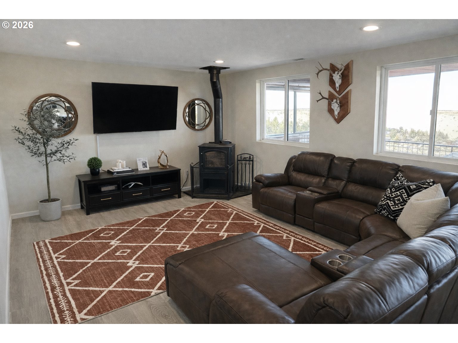 4463 Southwest Corral Drive Culver, OR 97734 - Photo 22 of 39 a living room with furniture a flat screen tv and a window