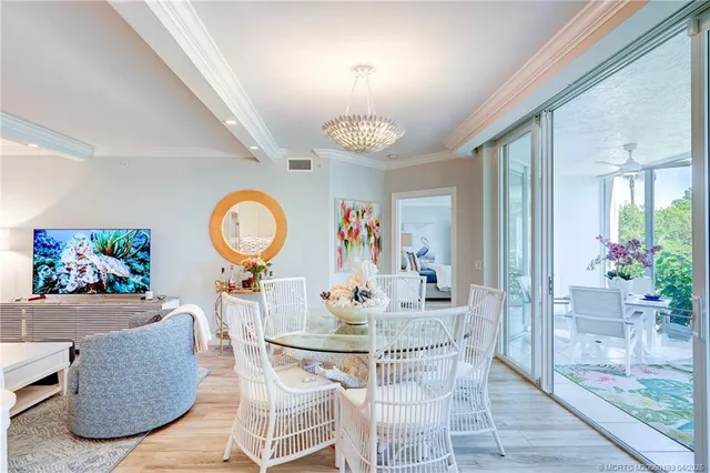 a large kitchen with a table and chairs in it