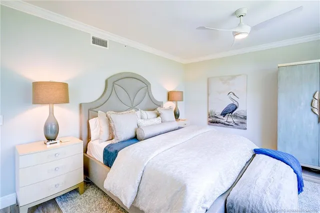 a view of a house with a small yard and plants