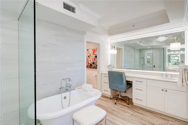 a large kitchen with a table and chairs in it