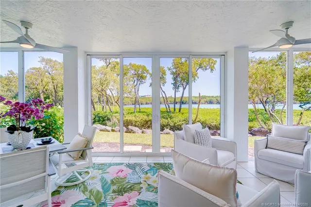 an aerial view of a house with a lake view