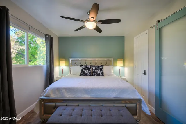 a bedroom with a bed and window