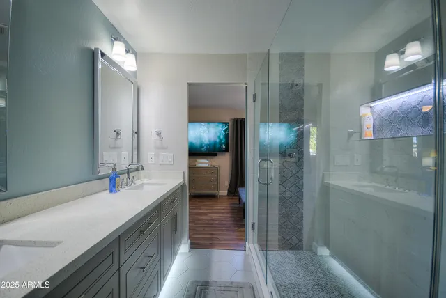 a bathroom with a sink and a mirror
