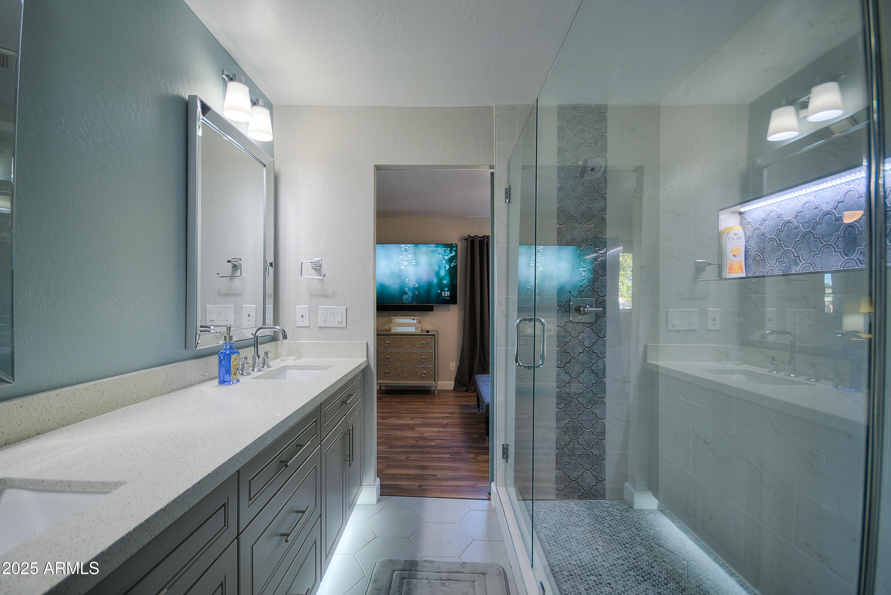 7603 East Montecito Avenue Scottsdale, AZ 85251 - Photo 18 of 21 a bathroom with a sink and a mirror