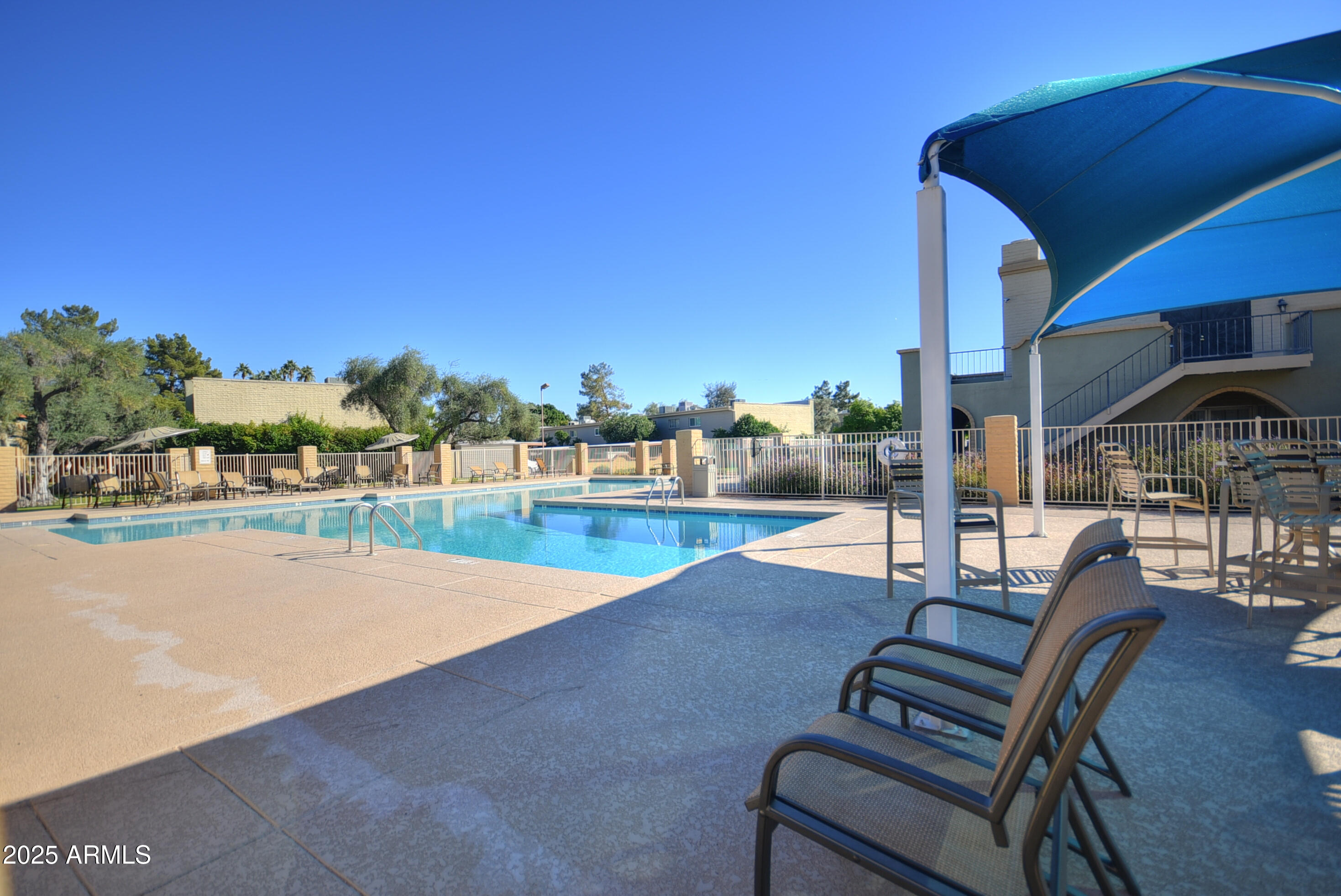 7603 East Montecito Avenue Scottsdale, AZ 85251 - Photo 20 of 21 a view of swimming pool with outdoor seating
