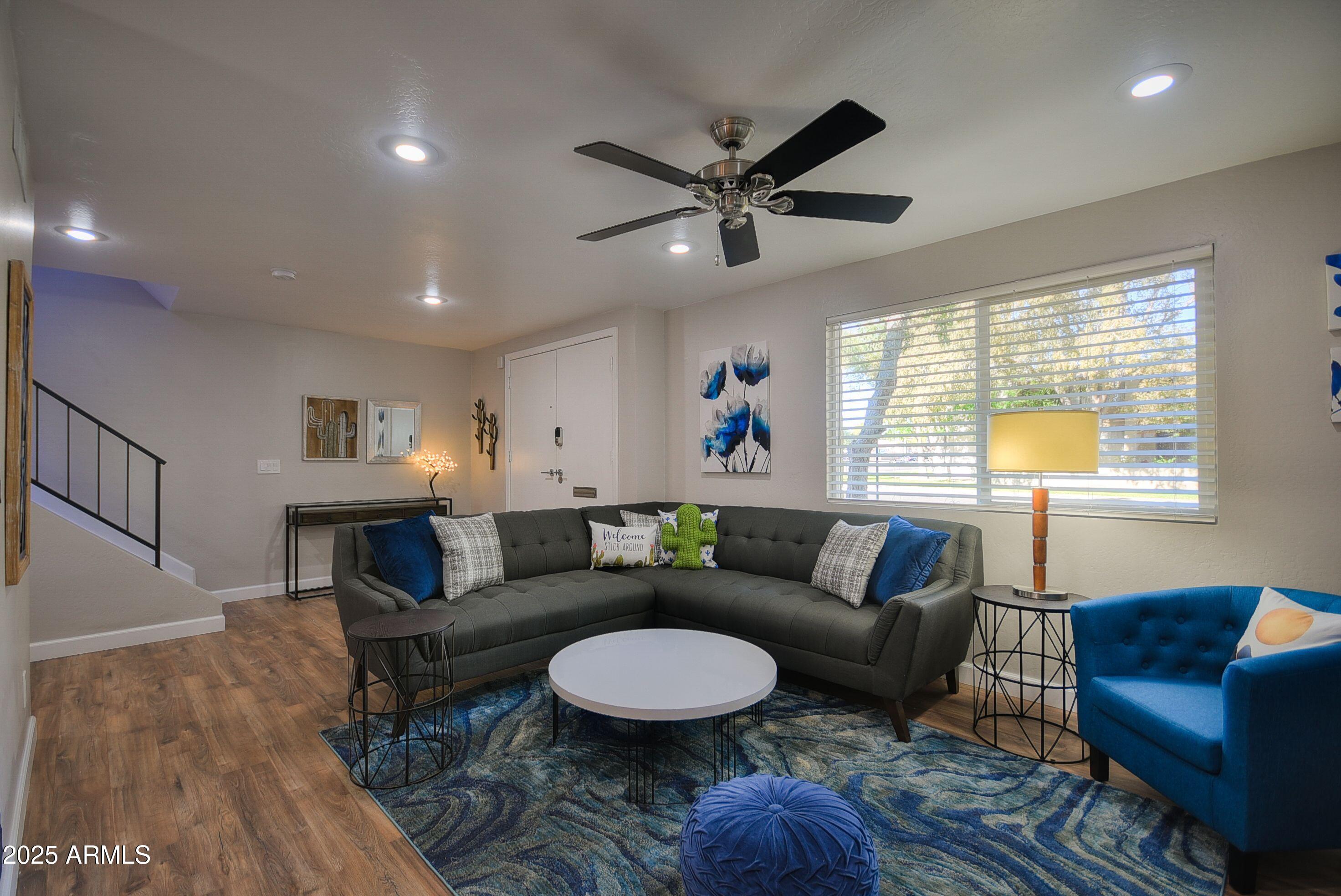 7603 East Montecito Avenue Scottsdale, AZ 85251 - Photo 4 of 21 a living room with furniture and a window