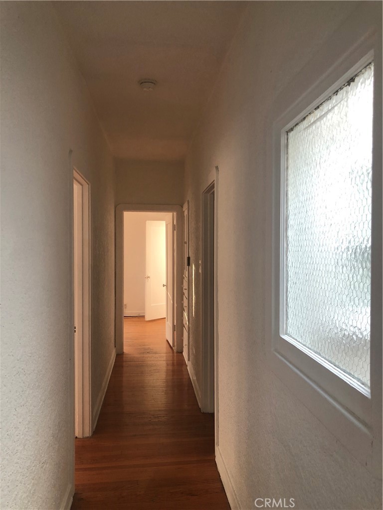 351 North Spaulding Avenue Los Angeles, CA 90036 - Photo 12 of 31 a view of hallway with wooden floor