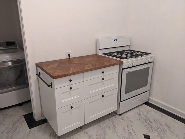 351 North Spaulding Avenue Los Angeles, CA 90036 - Photo 13 of 31 a kitchen with white cabinets and white appliances