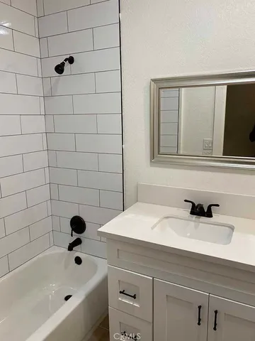 a bathroom with a sink and a bathtub
