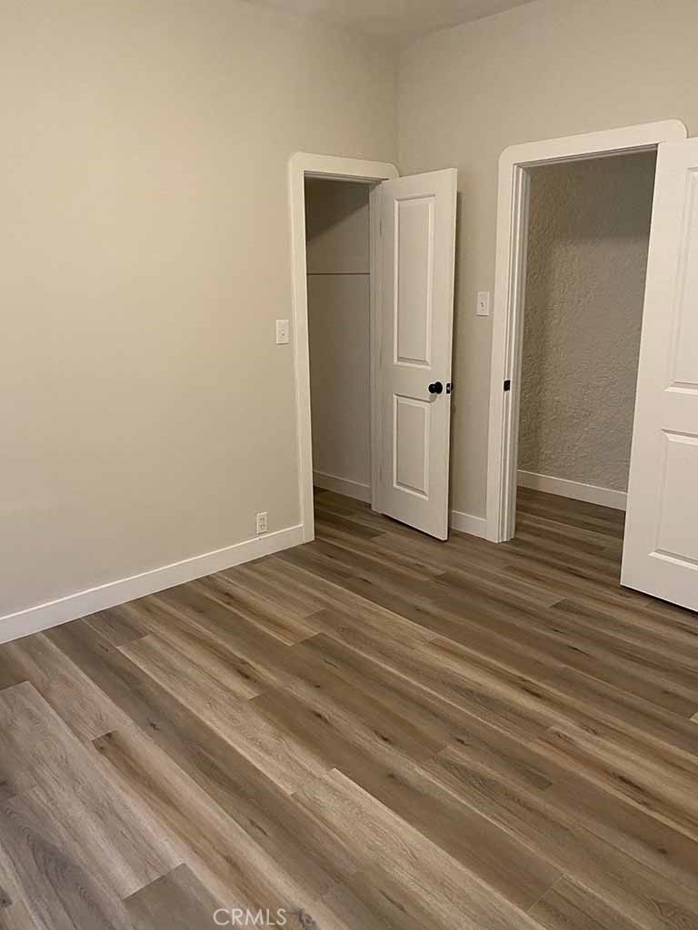 351 North Spaulding Avenue Los Angeles, CA 90036 - Photo 23 of 31 an empty room with wooden floor and closet