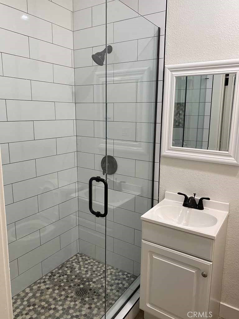 351 North Spaulding Avenue Los Angeles, CA 90036 - Photo 24 of 31 a bathroom with a sink a toilet and shower