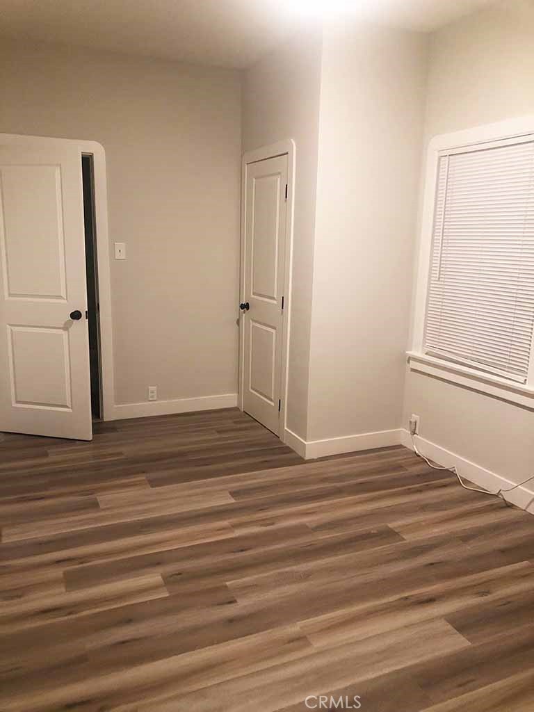 351 North Spaulding Avenue Los Angeles, CA 90036 - Photo 25 of 31 a view of a room with wooden floor and white doors