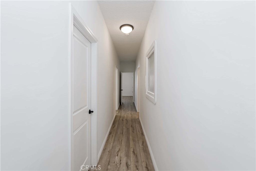 351 North Spaulding Avenue Los Angeles, CA 90036 - Photo 8 of 31 a view of a hallway with wooden floor