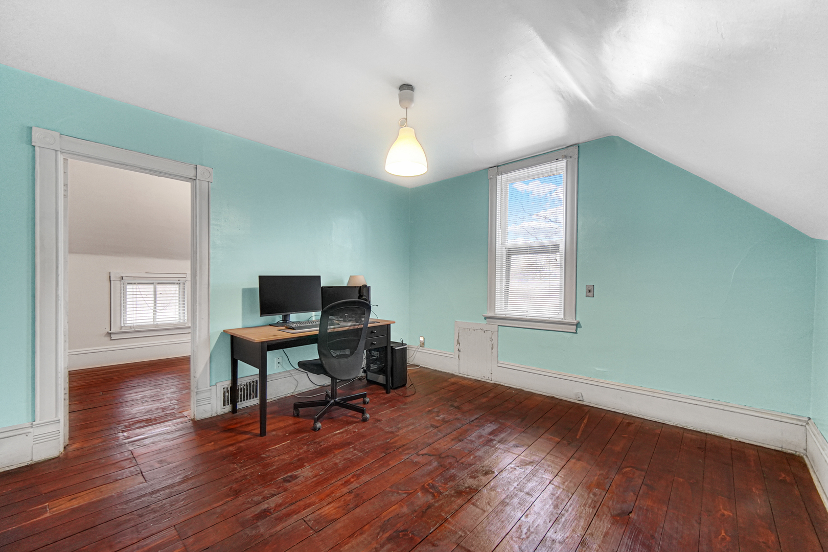 1112 South Jefferson Street Lockport, IL 60441 - Photo 17 of 21 a workspace with wooden floor a chandelier and windows