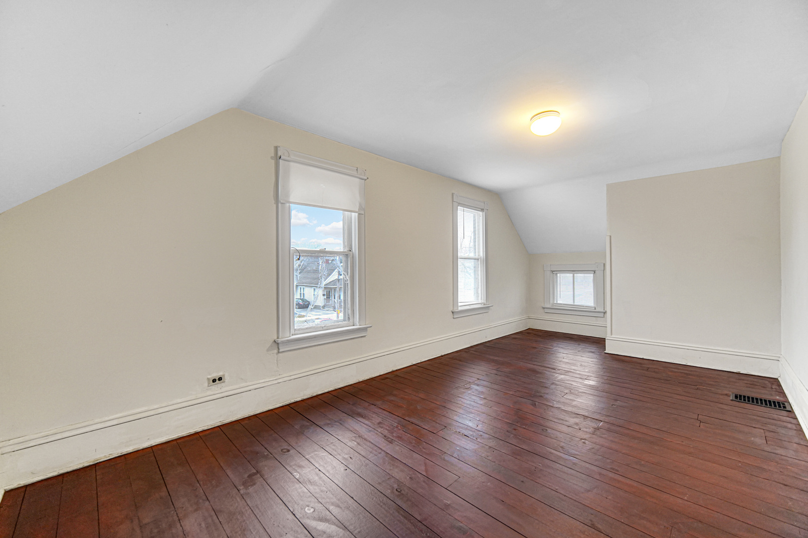 1112 South Jefferson Street Lockport, IL 60441 - Photo 20 of 21 an empty room with wooden floor and window